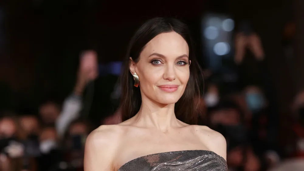 Angelina Jolie Channels Unfashionable Model in Elegant Black Cape